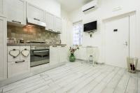 A kitchen or kitchenette at A Due Passi Da Toledo