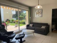 a living room with a couch and two chairs and a table at Appartement Capbreton, 2 pièces, 4 personnes - FR-1-239-872 in Capbreton