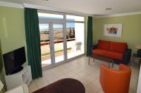 TV a/nebo společenská místnost v ubytování Apartamentos Arco Iris