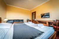 Postel nebo postele na pokoji v ubytování Hotel Sluníčko