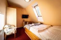 Postel nebo postele na pokoji v ubytování Hotel Sluníčko