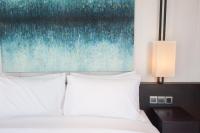 Ein Bett oder Betten in einem Zimmer der Unterkunft GLOW PARK HOTEL Grand Royal Palace