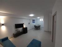 A television and/or entertainment centre at SYKA Thassos - Villa 4 Rooms SKALA RACHONIOU