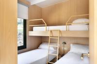 Posteľ alebo postele v izbe v ubytovaní wecamp Cala Montgó