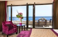 a bedroom with a view of the ocean at Hyatt Regency Nice Palais de la Méditerranée in Nice
