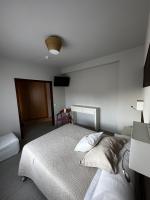 A bed or beds in a room at San Luis