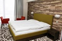 Postel nebo postele na pokoji v ubytování Hotel Freud