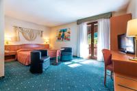 Posteľ alebo postele v izbe v ubytovaní Hotel La Perla