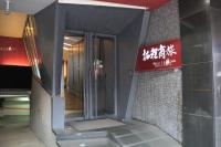 a elevator in a building with a sign on it at The Galerie Hotel in Taichung