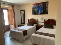 Posteľ alebo postele v izbe v ubytovaní Hotel Casa Museo de la Mezquita