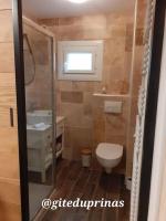 a bathroom with a toilet and a sink at Gite du Prinas in Gréolières
