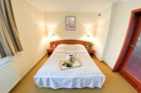 Posteľ alebo postele v izbe v ubytovaní Arena Hotel Spa & Wellness