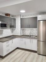 Kuchyň nebo kuchyňský kout v ubytování Apartamentos Doña Emilia