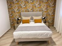 Postel nebo postele na pokoji v ubytování Apartamentos Doña Emilia