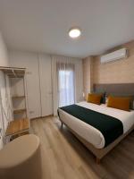 Postel nebo postele na pokoji v ubytování Apartamentos Doña Emilia
