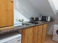Kuchyňa alebo kuchynka v ubytovaní Rasa Sayang Apartments City Centre