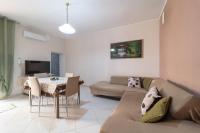 A television and/or entertainment centre at MIROS APARTMENT