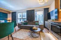 Telewizja i/lub zestaw kina domowego w obiekcie Glow Apartments, Letnica - Apartamenty Przystań Siódme Niebo