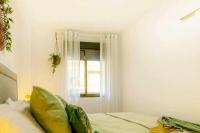 A bed or beds in a room at Apartamento Pink Arena