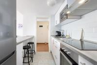Kuchyň nebo kuchyňský kout v ubytování Home2Book Poris Ocean View