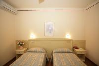 Łóżko lub łóżka w pokoju w obiekcie Hotel Ezzelino