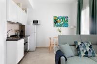 Kuchyňa alebo kuchynka v ubytovaní HOMEABOUT Juan de Austria Apartments