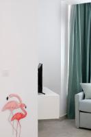 Televízia a/alebo spoločenská miestnosť v ubytovaní HOMEABOUT Juan de Austria Apartments