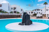 Bazén v ubytování Vivienda Vacacional Tamarindo nebo v jeho okolí