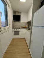 A kitchen or kitchenette at Second Home Arzúa apartamentos