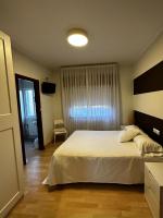 A bed or beds in a room at San Luis