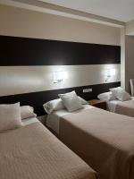 A bed or beds in a room at San Luis