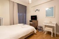 Televízia a/alebo spoločenská miestnosť v ubytovaní Glyfada golf fourth floor apartment