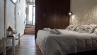 A bed or beds in a room at Angolo Dei Priori - city center-