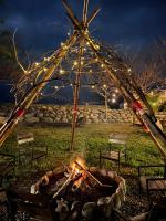 a fire pit in a park at night with lights at Bridge12th B&amp;B in Yanliau