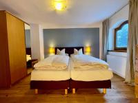 Łóżko lub łóżka w pokoju w obiekcie Chalet Augustine Hinterglemm Zentrum