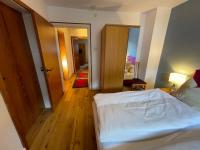 Łóżko lub łóżka w pokoju w obiekcie Chalet Augustine Hinterglemm Zentrum