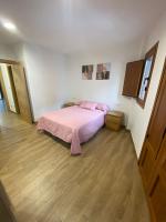 A bed or beds in a room at El Capricho