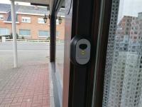 a door with a lock on a glass door at Logies Lily in Oudenburg