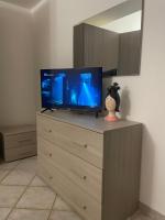 A television and/or entertainment centre at LA CASA TRA GLI ULIVI