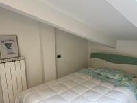 A bed or beds in a room at LA CASA TRA GLI ULIVI