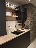 Kuchyňa alebo kuchynka v ubytovaní le J&J Appartement spacieux climatisé en centre ville