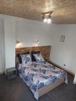 Łóżko lub łóżka w pokoju w obiekcie Appartement comme à la maison
