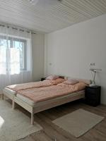 Cama ou camas em um quarto em Lizi Apartman