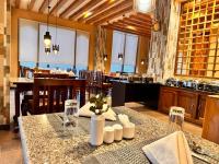 a dining room with a table in a restaurant at NUMINOUS HOTEL in Thimphu