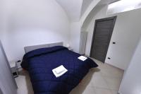 Posteľ alebo postele v izbe v ubytovaní Apartments Casa Vacanze Dante