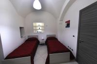 Posteľ alebo postele v izbe v ubytovaní Apartments Casa Vacanze Dante