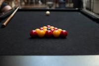 a group of balls on a pool table at Nomads St Kilda in Melbourne