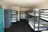 a group of bunk beds in a dorm room at Nomads St Kilda in Melbourne