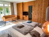 Posteľ alebo postele v izbe v ubytovaní Chalets Franciska Major, Pro Village