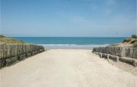 a dirt road leading to the ocean on a beach at Stunning Home In Saint-vivien-de-medoc With 4 Bedrooms And Outdoor Swimming Pool in Saint-Vivien-de-Médoc